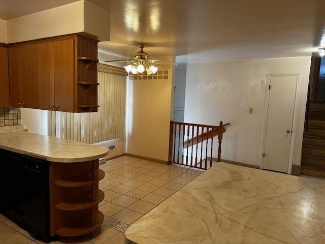 kitchen featuring tasteful backsplash, light tile patterned floors, and ceiling fan