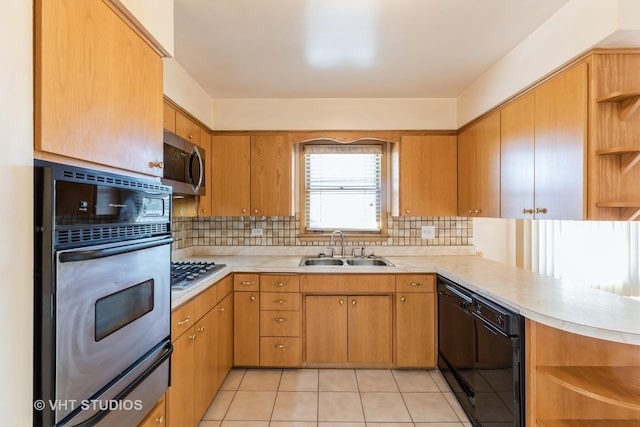 kitchen featuring open shelves, light countertops, appliances with stainless steel finishes, and a sink