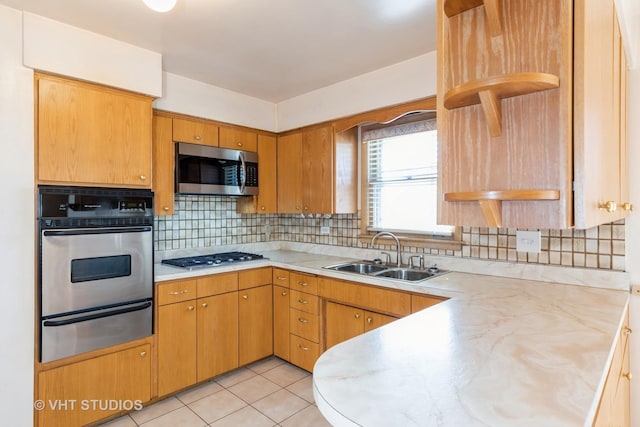 kitchen featuring a sink, light countertops, appliances with stainless steel finishes, a warming drawer, and open shelves