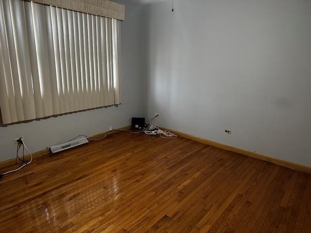 empty room featuring hardwood / wood-style floors