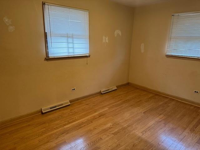 unfurnished room featuring light wood-type flooring