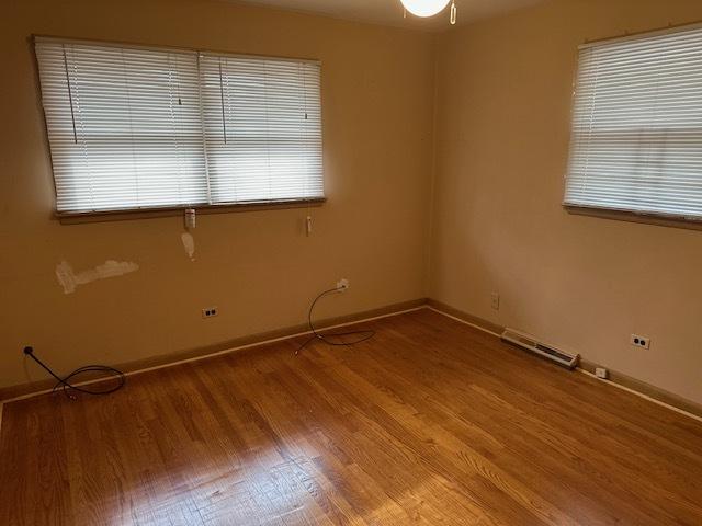 spare room featuring hardwood / wood-style floors