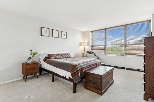 bedroom with light colored carpet