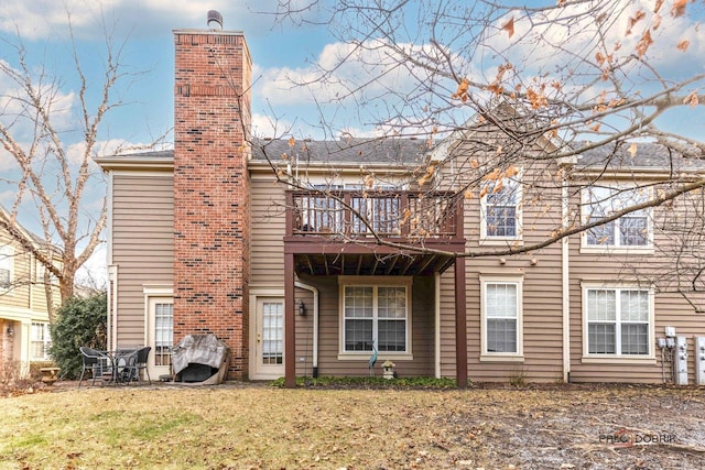 rear view of house with a lawn