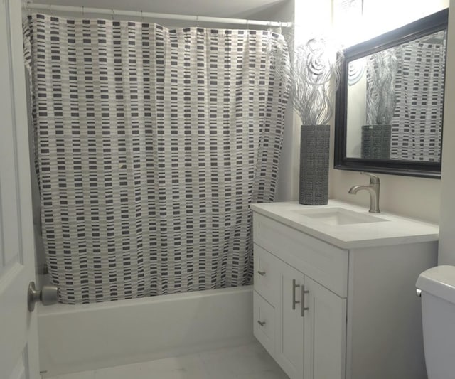 full bathroom featuring toilet, vanity, and shower / bath combination with curtain