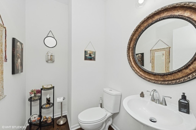 bathroom with sink and toilet