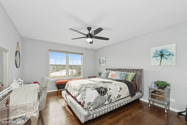 bedroom featuring ceiling fan and dark hardwood / wood-style flooring