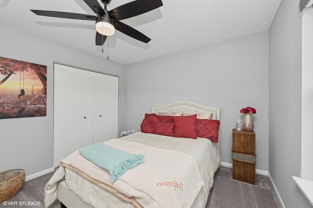 bedroom with ceiling fan, a closet, and dark colored carpet