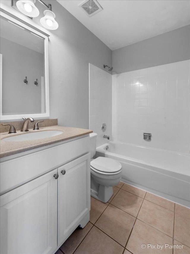 full bathroom featuring shower / bathing tub combination, tile patterned floors, vanity, and toilet