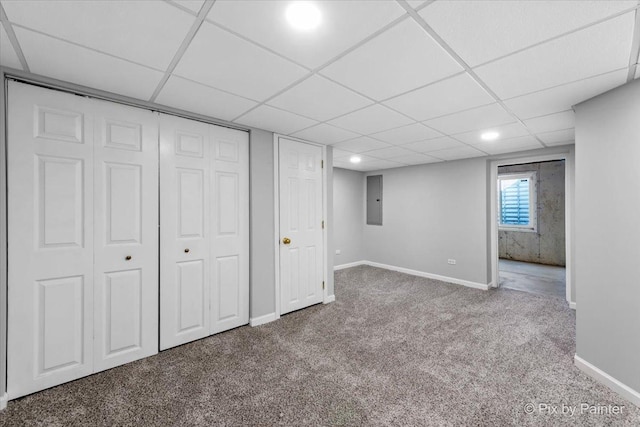 basement featuring electric panel and carpet floors