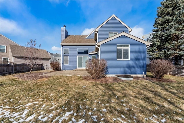 back of house featuring a yard and a patio