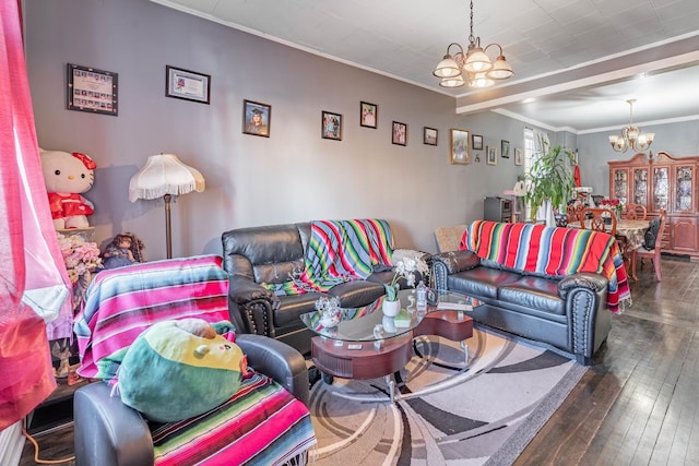 living room featuring dark hardwood / wood-style flooring, crown molding, and a chandelier