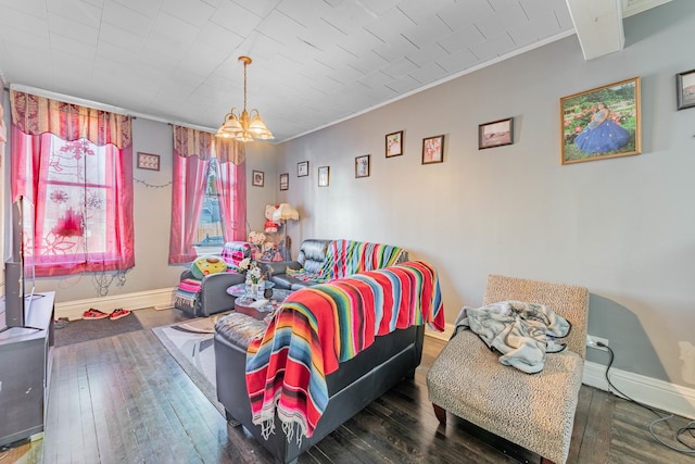 bedroom featuring dark hardwood / wood-style floors, an inviting chandelier, and ornamental molding