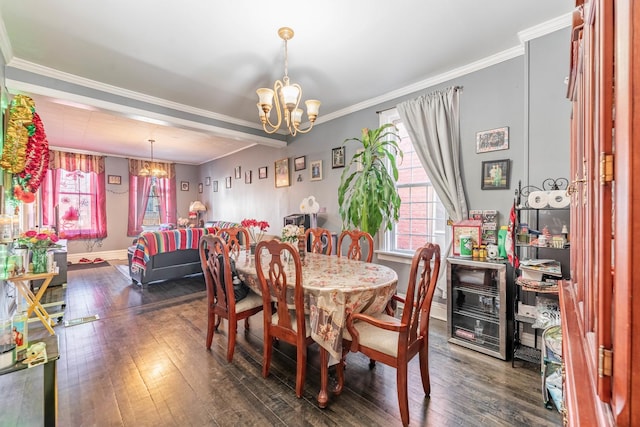 dining area featuring dark hardwood / wood-style floors, crown molding, and an inviting chandelier