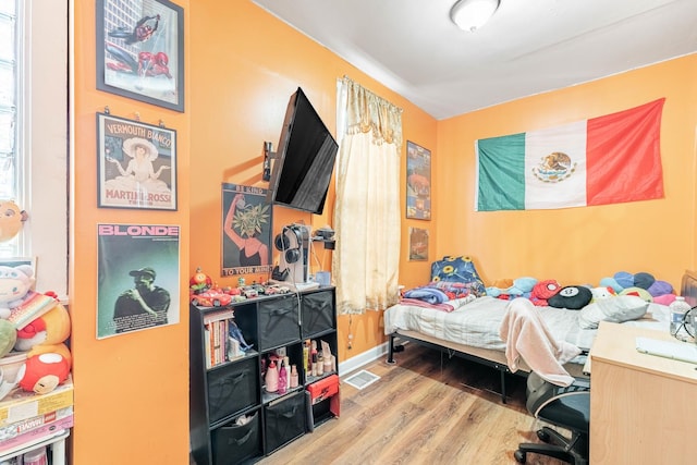 bedroom featuring wood-type flooring