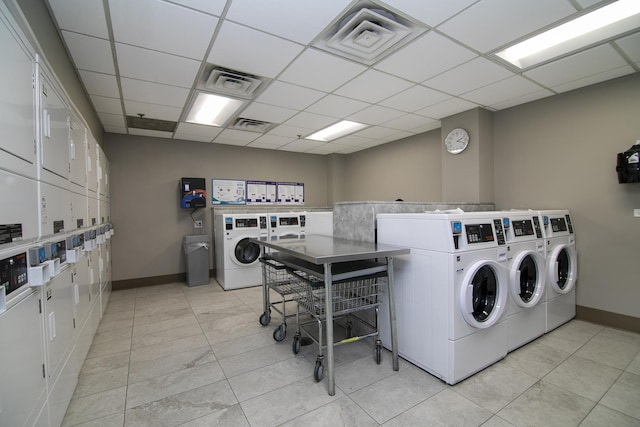 laundry area featuring stacked washer / drying machine and washer and clothes dryer