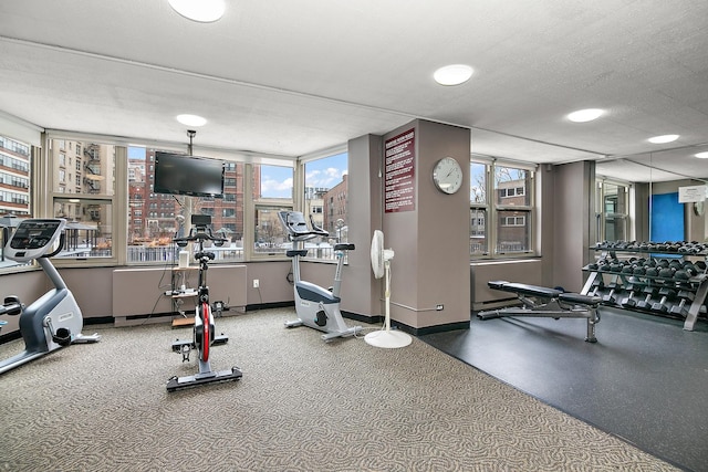 gym with a textured ceiling