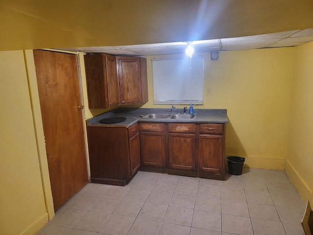 kitchen featuring sink and light tile patterned floors