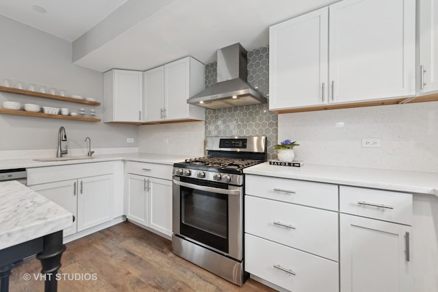 kitchen featuring sink, white cabinetry, wall chimney exhaust hood, and stainless steel appliances