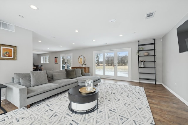 living room featuring french doors and wood-type flooring