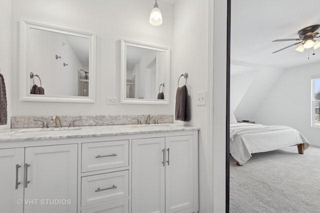 bathroom with vanity, ceiling fan, and lofted ceiling