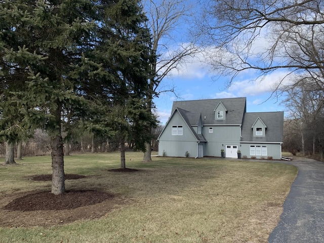 view of property exterior with a lawn