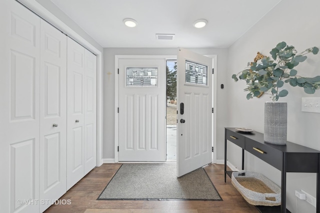 foyer entrance with dark wood-type flooring