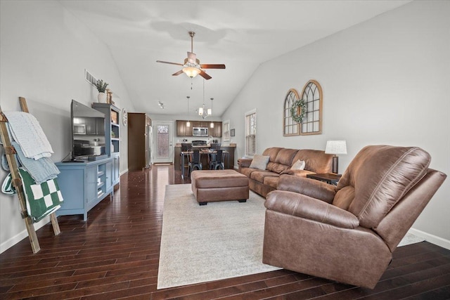 living room with lofted ceiling, dark hardwood / wood-style floors, and ceiling fan