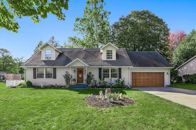 cape cod home featuring a garage and a front yard