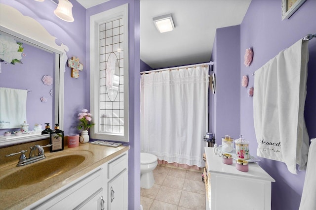 bathroom featuring a shower with curtain, tile patterned floors, vanity, and toilet