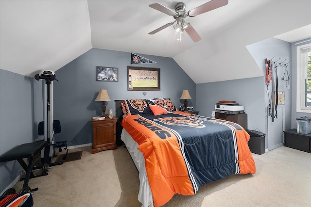 bedroom with light carpet, vaulted ceiling, and ceiling fan