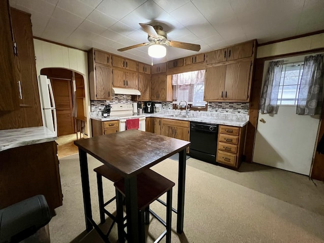 kitchen with ceiling fan, white appliances, sink, and backsplash