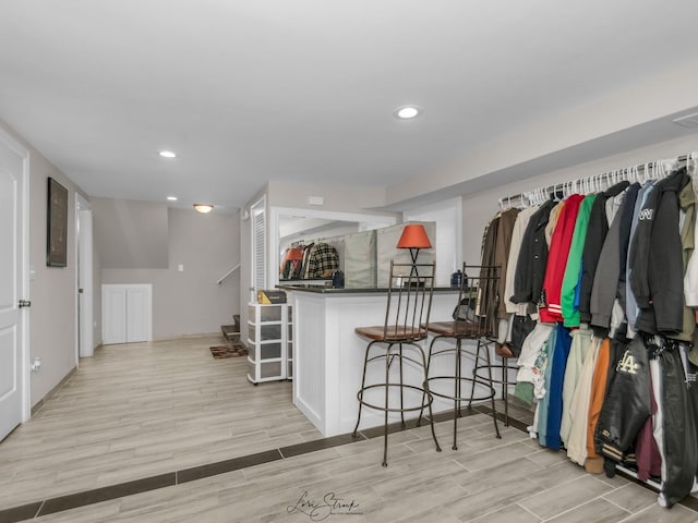 spacious closet featuring light hardwood / wood-style floors