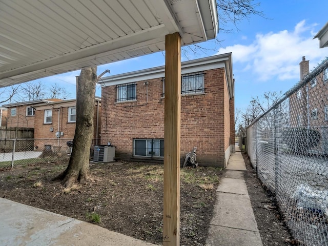 view of side of home featuring cooling unit