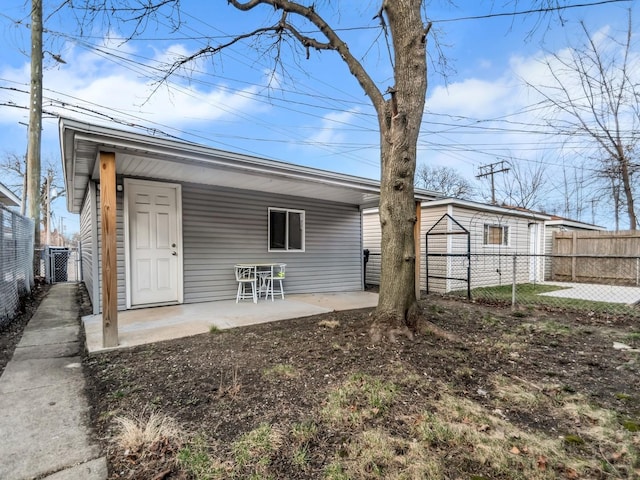 rear view of house featuring central air condition unit