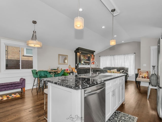 kitchen with pendant lighting, white cabinetry, an island with sink, sink, and stainless steel dishwasher