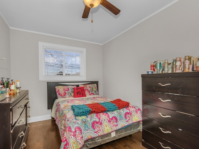 bedroom with ceiling fan, dark hardwood / wood-style flooring, and crown molding