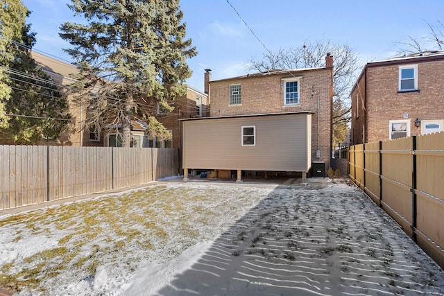 rear view of property featuring central AC unit