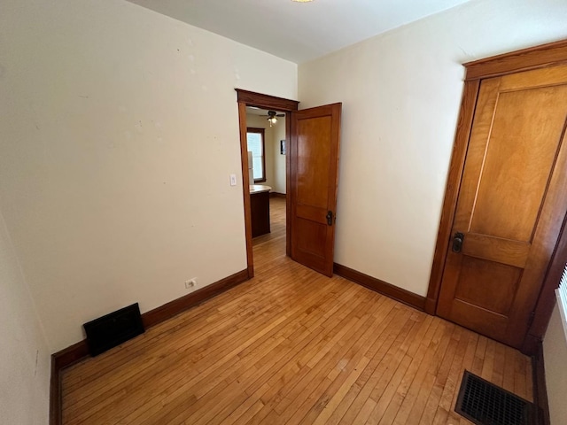 unfurnished bedroom featuring light wood-type flooring