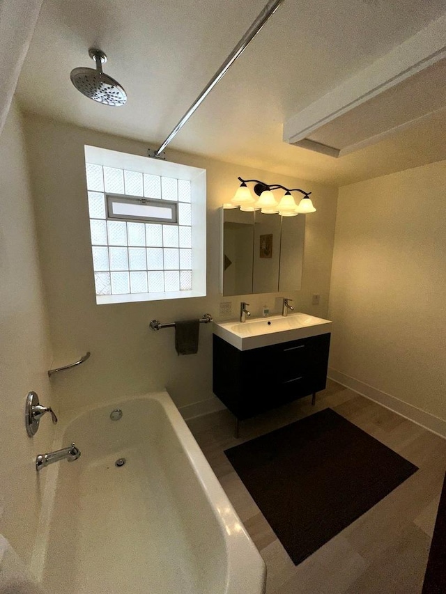 bathroom with wood-type flooring, separate shower and tub, and vanity