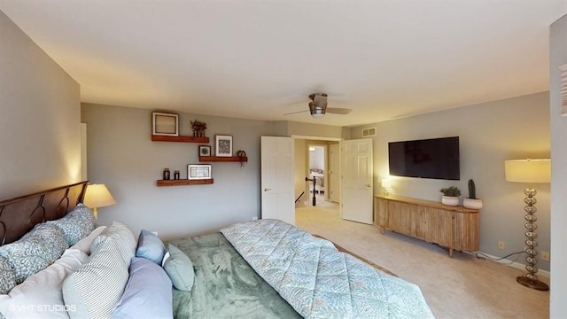 bedroom with light colored carpet and ceiling fan