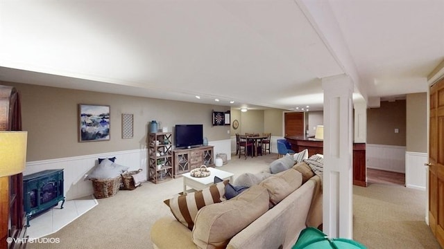 living room featuring decorative columns and light colored carpet