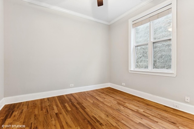 unfurnished room with crown molding, hardwood / wood-style floors, and ceiling fan