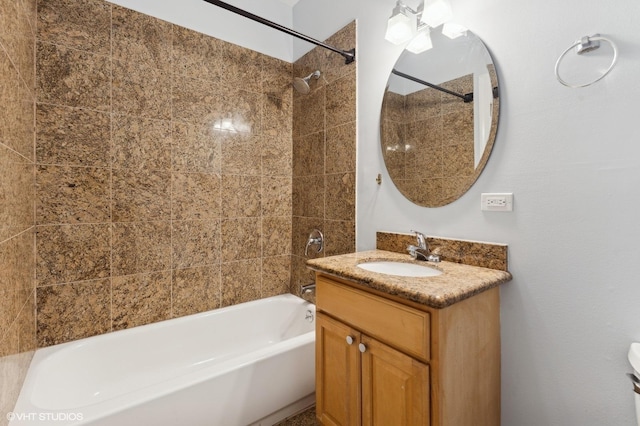 bathroom featuring vanity and tiled shower / bath combo