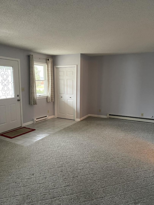 interior space featuring baseboard heating and a textured ceiling