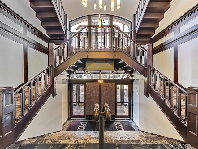 entrance foyer featuring french doors and a high ceiling