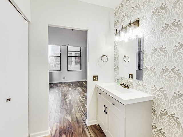 bathroom featuring hardwood / wood-style flooring and vanity