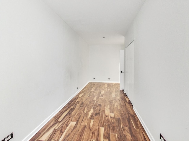 corridor featuring hardwood / wood-style floors