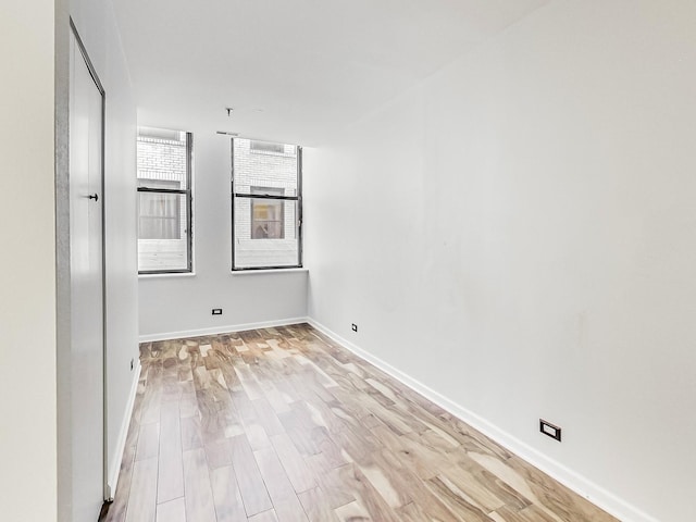 unfurnished room featuring light hardwood / wood-style floors