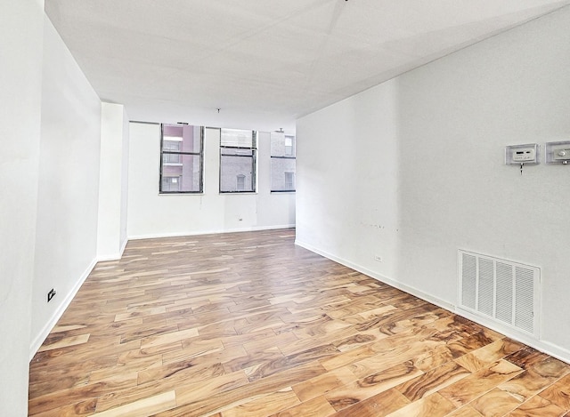 spare room featuring light wood-type flooring